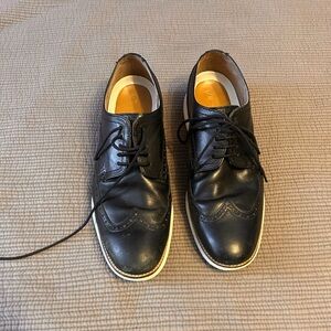 Cole Haan Black Leather Wingtip Derby Shoes with White Trim